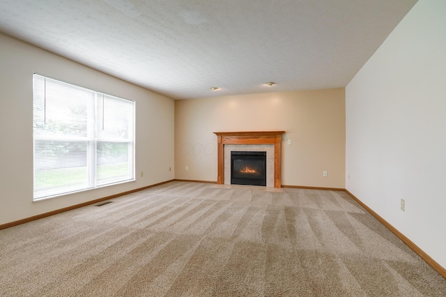 2378 Myrtle Valley Dr, Columbus, OH 43228 - unfurnished living room with light colored carpet, a tiled fireplace, and baseboards