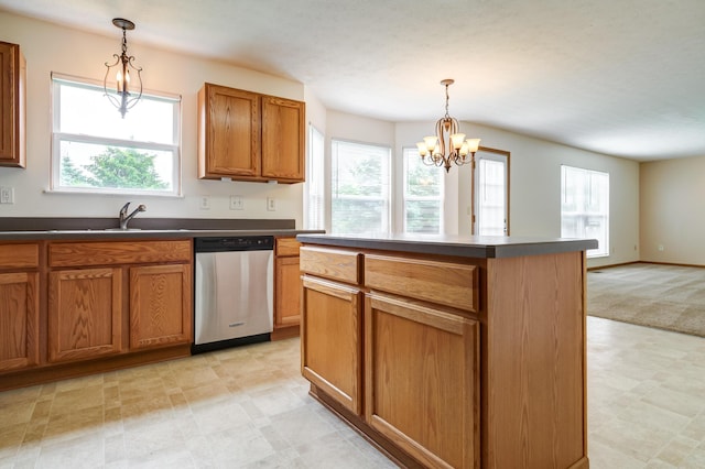 2378 Myrtle Valley Dr, Columbus, OH 43228 - kitchen with stainless steel dishwasher, a sink, dark countertops, light floors, and brown cabinetry