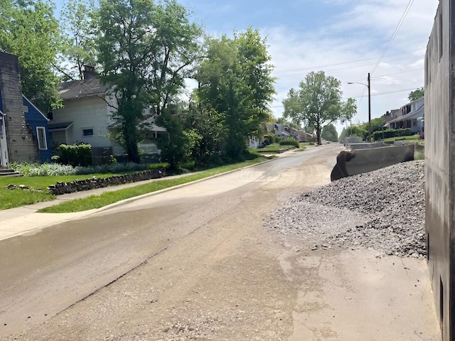 1373 Oakwood Ave, Columbus, OH 43206 - view of asphalt road with street lighting, a residential view, sidewalks, and curbs