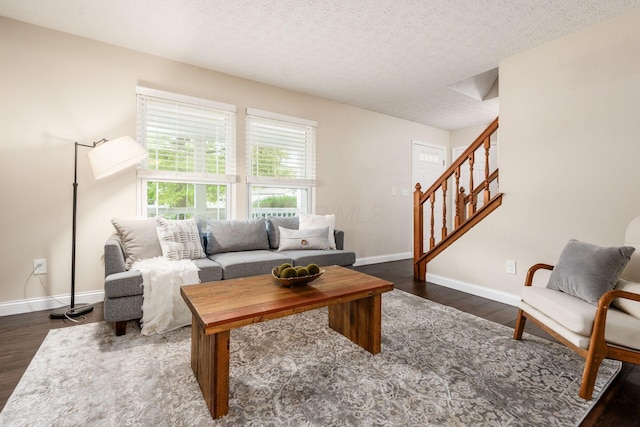 1693 Hale Ct, Columbus, OH 43228 - living area featuring wood finished floors, stairs, baseboards, and a textured ceiling