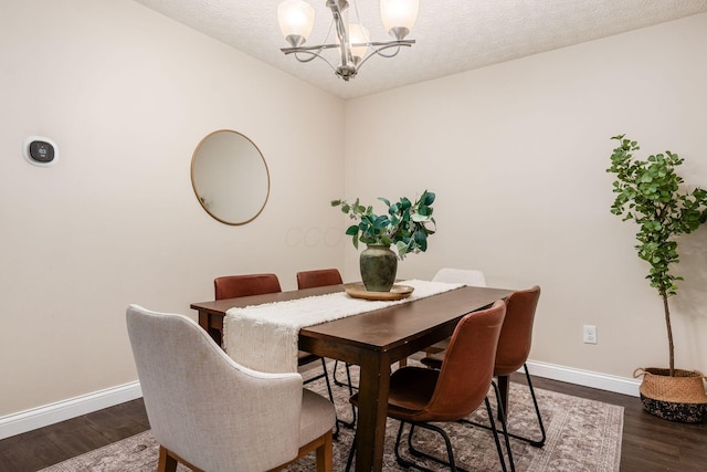 1693 Hale Ct, Columbus, OH 43228 - dining area with a chandelier, baseboards, dark wood-type flooring, and a textured ceiling