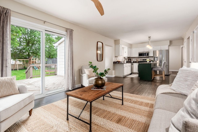 1693 Hale Ct, Columbus, OH 43228 - living room featuring dark wood-style floors, ceiling fan, and baseboards