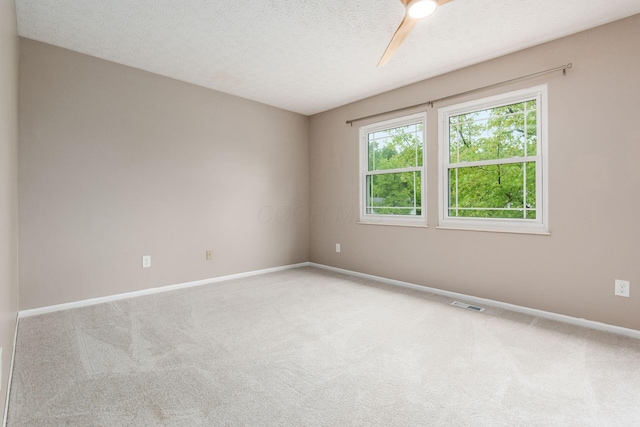 1693 Hale Ct, Columbus, OH 43228 - spare room featuring carpet flooring, baseboards, a textured ceiling, and ceiling fan