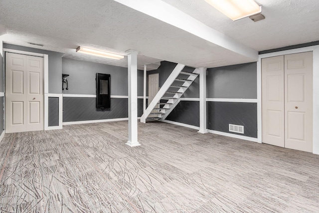 1693 Hale Ct, Columbus, OH 43228 - finished basement featuring a textured ceiling and stairway