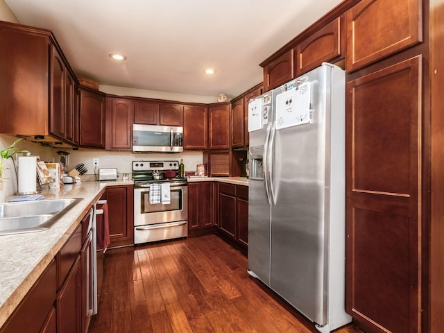 193 W Pearl St, West Jefferson, OH 43162 - kitchen featuring stainless steel appliances, dark wood-style floors, light countertops, recessed lighting, and a sink