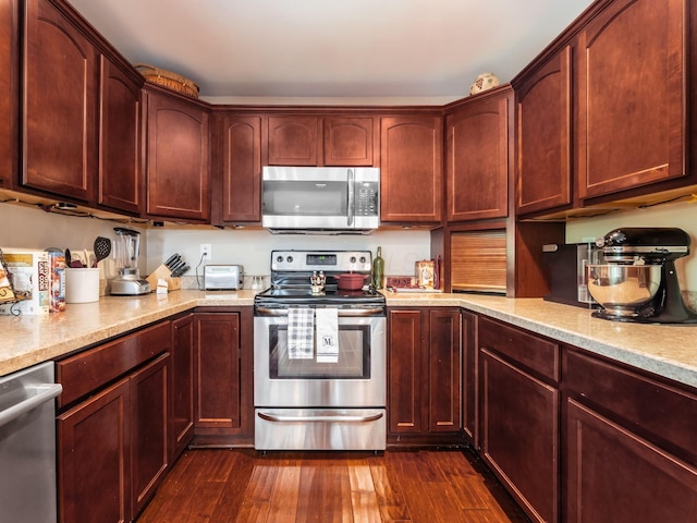 193 W Pearl St, West Jefferson, OH 43162 - kitchen with stainless steel appliances, dark wood-type flooring, dark brown cabinets, and light stone countertops