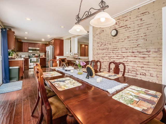 193 W Pearl St, West Jefferson, OH 43162 - dining space with brick wall, dark wood-style flooring, and recessed lighting