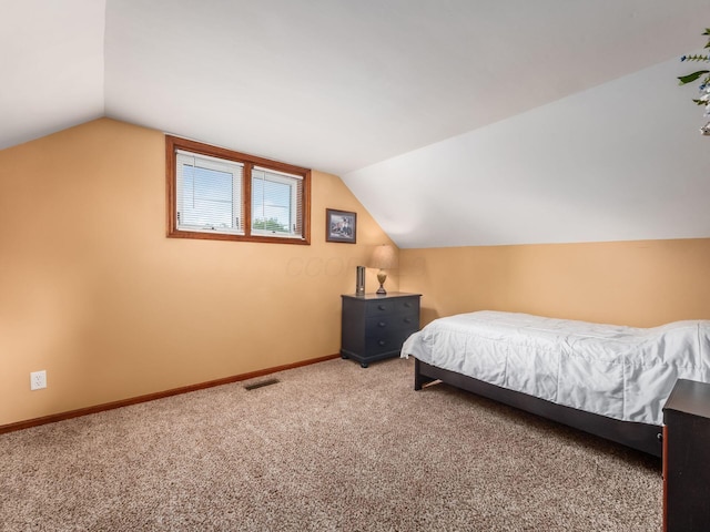 193 W Pearl St, West Jefferson, OH 43162 - carpeted bedroom with vaulted ceiling and baseboards