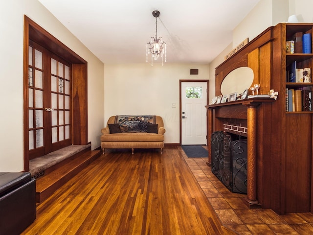 193 W Pearl St, West Jefferson, OH 43162 - living area featuring dark wood-style flooring and a chandelier