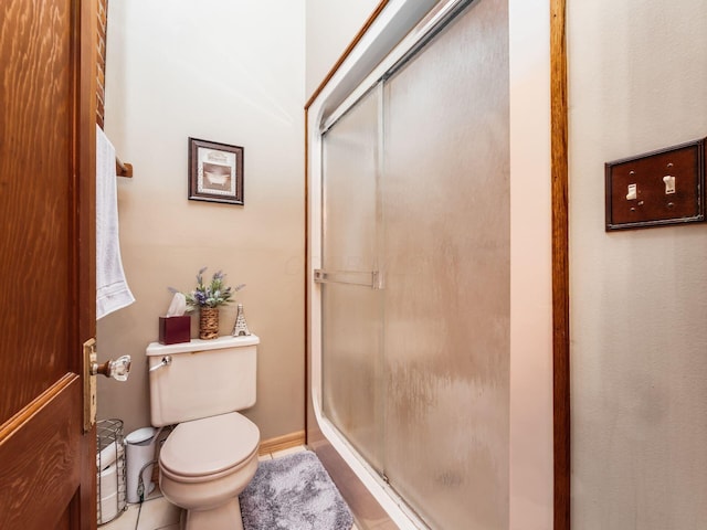 193 W Pearl St, West Jefferson, OH 43162 - full bath with a shower stall, toilet, and tile patterned flooring