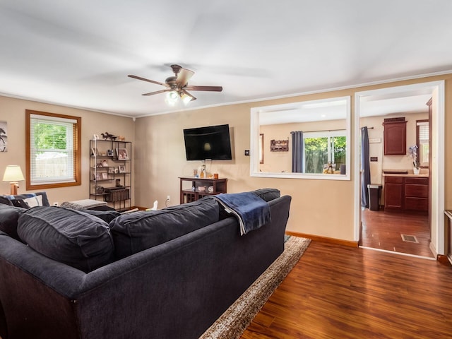 193 W Pearl St, West Jefferson, OH 43162 - living area with dark wood finished floors, a ceiling fan, and baseboards