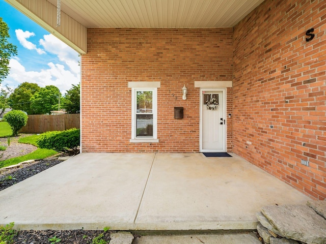 193 W Pearl St, West Jefferson, OH 43162 - doorway to property with a patio area and brick siding