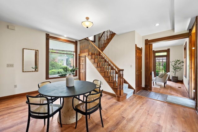 41 Hanford St, Columbus, OH 43206 - dining room with light wood finished floors, stairway, baseboards, and recessed lighting
