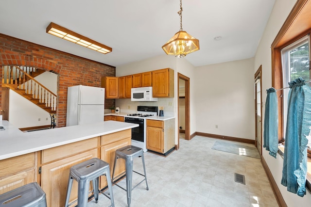 41 Hanford St, Columbus, OH 43206 - kitchen featuring white appliances, a sink, baseboards, a chandelier, and light countertops