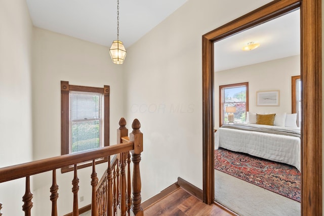 41 Hanford St, Columbus, OH 43206 - corridor with an upstairs landing, baseboards, and dark wood-style floors