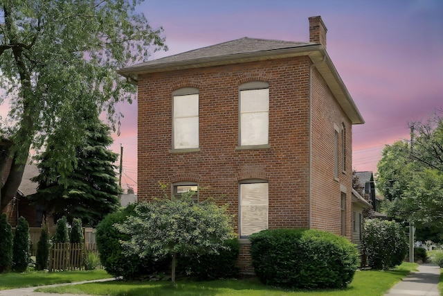 41 Hanford St, Columbus, OH 43206 - property exterior at dusk featuring a chimney and brick siding