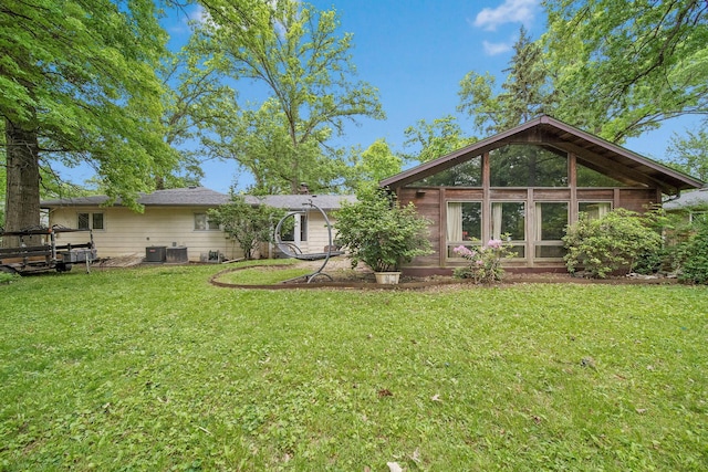 2692 Jordan Rd, Columbus, OH 43231 - back of house featuring a lawn and central AC