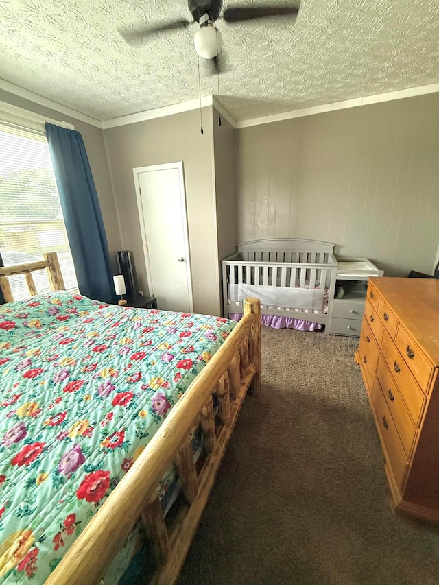 205 Walnut St, Circleville, OH 43113 - carpeted bedroom with crown molding, a textured ceiling, and ceiling fan