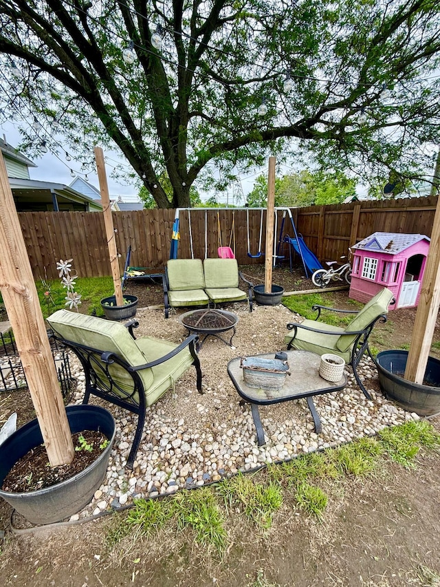 205 Walnut St, Circleville, OH 43113 - fenced backyard featuring a fire pit and a patio area
