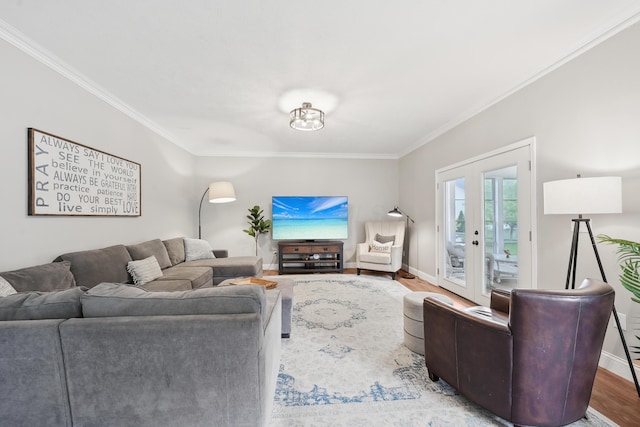 5952 Hampton Cors S, Hilliard, OH 43026 - living room featuring ornamental molding, baseboards, wood finished floors, and french doors