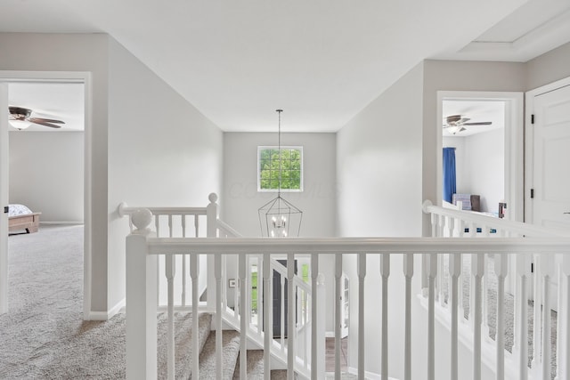 5952 Hampton Cors S, Hilliard, OH 43026 - hall with carpet, an upstairs landing, a chandelier, and baseboards