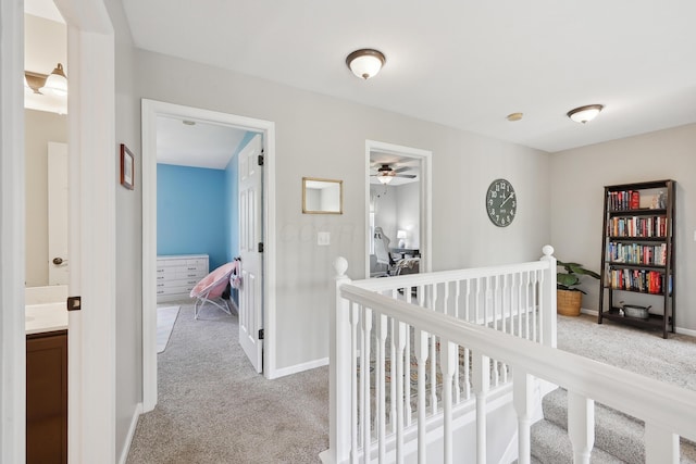 5952 Hampton Cors S, Hilliard, OH 43026 - hall featuring light colored carpet, an upstairs landing, and baseboards