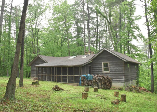 311 Chinook Ln, Sugar Grove, OH 43155 - rear view of property with a sunroom, a chimney, and a shingled roof