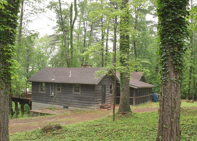 311 Chinook Ln, Sugar Grove, OH 43155 - back of property with a chimney, roof with shingles, a deck, and a sunroom