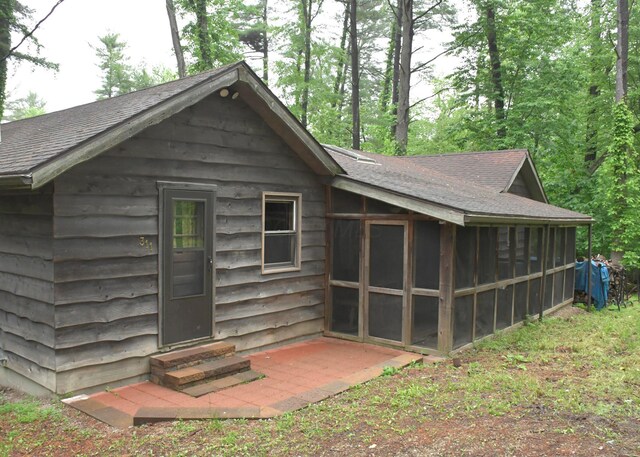 311 Chinook Ln, Sugar Grove, OH 43155 - rear view of house with entry steps, a sunroom, and a shingled roof