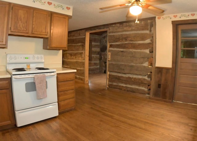 311 Chinook Ln, Sugar Grove, OH 43155 - kitchen featuring electric stove, wooden walls, wood finished floors, ceiling fan, and brown cabinetry