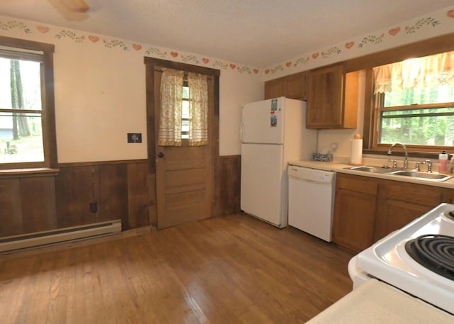 311 Chinook Ln, Sugar Grove, OH 43155 - kitchen featuring white appliances, a sink, brown cabinets, wainscoting, and baseboard heating