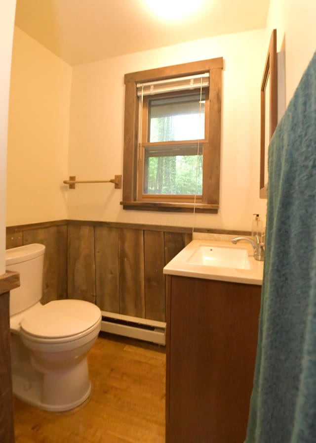 311 Chinook Ln, Sugar Grove, OH 43155 - bathroom with a baseboard heating unit, vanity, toilet, and wood finished floors