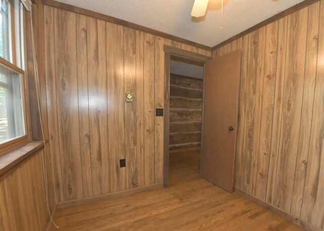 311 Chinook Ln, Sugar Grove, OH 43155 - empty room featuring wood walls, wood finished floors, ceiling fan, and a textured ceiling