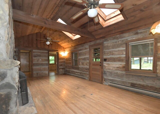 311 Chinook Ln, Sugar Grove, OH 43155 - unfurnished living room featuring a skylight, a ceiling fan, wood finished floors, wooden ceiling with exposed beams, and baseboard heating