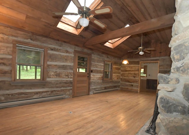 311 Chinook Ln, Sugar Grove, OH 43155 - unfurnished living room with a skylight, a baseboard radiator, a ceiling fan, wooden ceiling with exposed beams, and wood walls