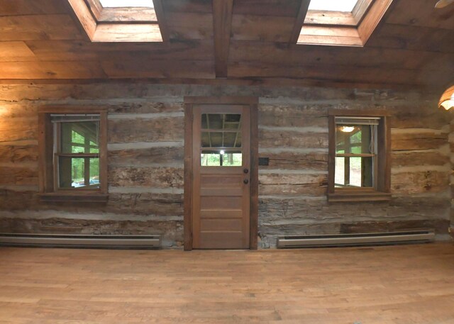 311 Chinook Ln, Sugar Grove, OH 43155 - foyer entrance with a skylight, wood ceiling with exposed beams, a baseboard heating unit, wood finished floors, and healthy amount of natural light