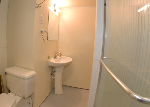 311 Chinook Ln, Sugar Grove, OH 43155 - full bathroom featuring toilet, concrete floors, and a shower
