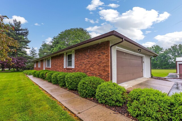 5786 Thompson Rd, Columbus, OH 43230 - view of side of home featuring a lawn and brick siding