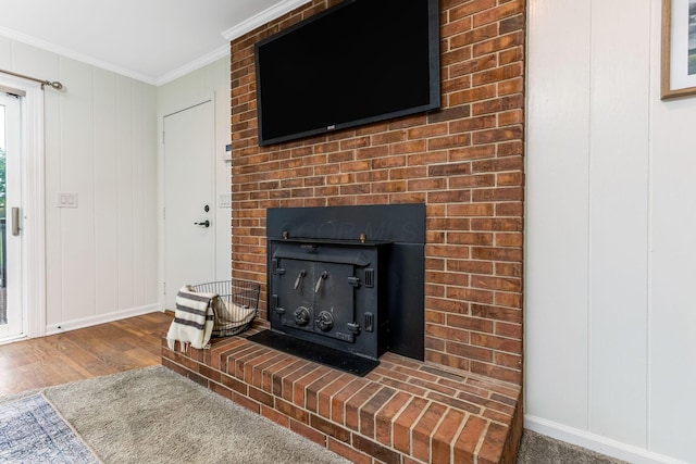 5786 Thompson Rd, Columbus, OH 43230 - detailed view of crown molding, wood finished floors, baseboards, and a fireplace
