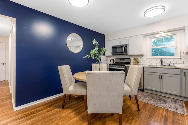 5786 Thompson Rd, Columbus, OH 43230 - dining space featuring light wood-type flooring and baseboards