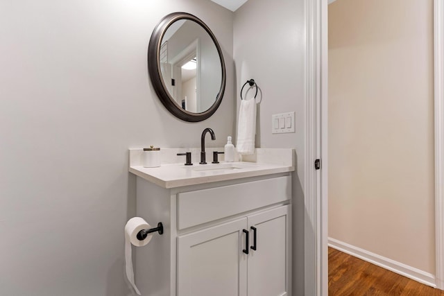 5786 Thompson Rd, Columbus, OH 43230 - bathroom with vanity, baseboards, and wood finished floors