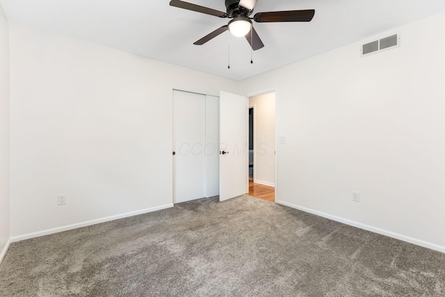 5786 Thompson Rd, Columbus, OH 43230 - unfurnished bedroom featuring carpet, baseboards, a closet, and ceiling fan