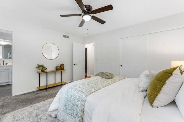 5786 Thompson Rd, Columbus, OH 43230 - bedroom featuring light carpet, a closet, ensuite bathroom, a ceiling fan, and a sink