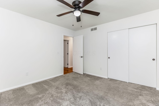 5786 Thompson Rd, Columbus, OH 43230 - unfurnished bedroom with carpet floors, a closet, baseboards, and a ceiling fan