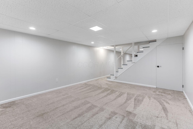5786 Thompson Rd, Columbus, OH 43230 - finished below grade area with stairway, carpet flooring, a paneled ceiling, baseboards, and recessed lighting