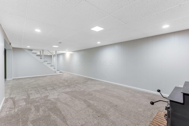 5786 Thompson Rd, Columbus, OH 43230 - finished below grade area with carpet floors, stairs, baseboards, a drop ceiling, and recessed lighting