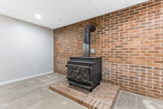 5786 Thompson Rd, Columbus, OH 43230 - detailed view of carpet flooring, a wood stove, and baseboards