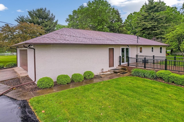 5786 Thompson Rd, Columbus, OH 43230 - back of property with stucco siding, roof with shingles, and a deck