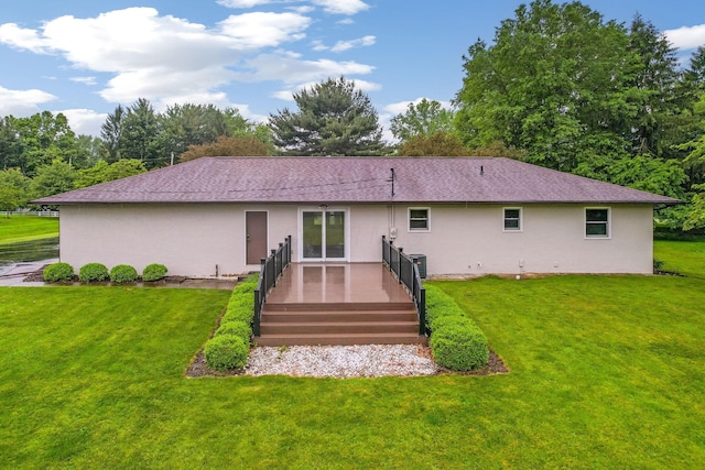 5786 Thompson Rd, Columbus, OH 43230 - rear view of house with stucco siding, a yard, a deck, and cooling unit