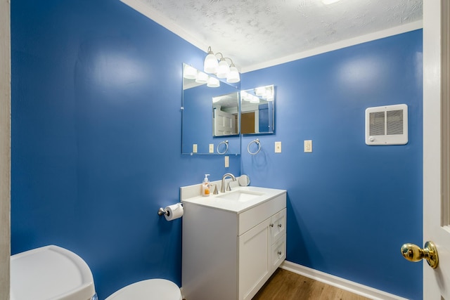 526 N Columbus St, Lancaster, OH 43130 - half bath featuring toilet, wood finished floors, vanity, and baseboards